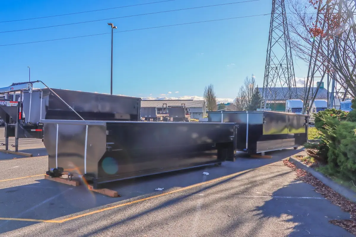Roll-off dumpster ready for waste disposal at job site for 12 Yard Dumpster Rental in Broussard